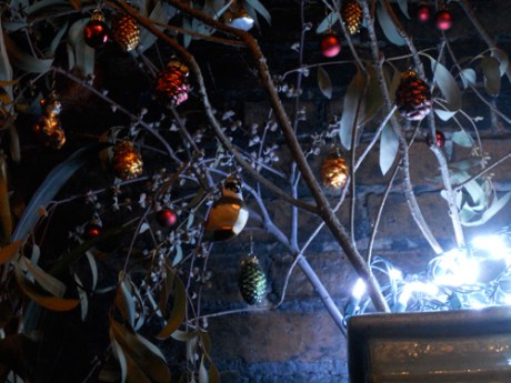 Our little branches  and glass ornaments illuminated in blue-whit light.