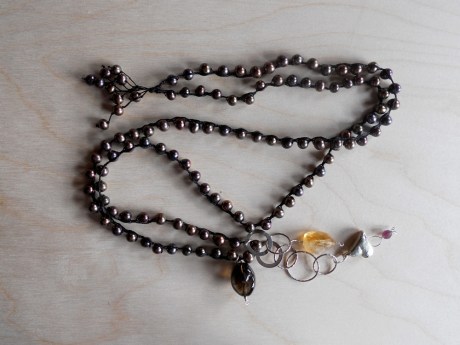 Rich dark brown pearls with semi precious stones, silver chain and a heart pendant by GJ Pearson.