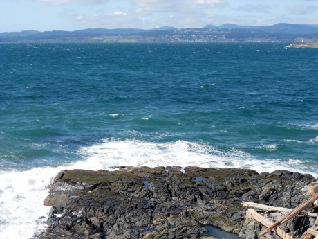 Big waves and the water was a magnificent colour. A tiny bot of Ogden Point and the Sooke Hills in the background.
