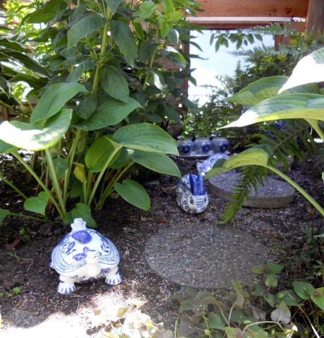 Mirrors create depth and highlight a lovely collection of blue and white pottery.