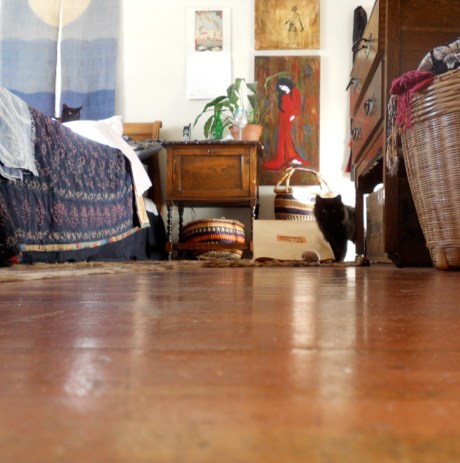 Exploring her new home while big brother Carlos peeks at her from his pillow fort.