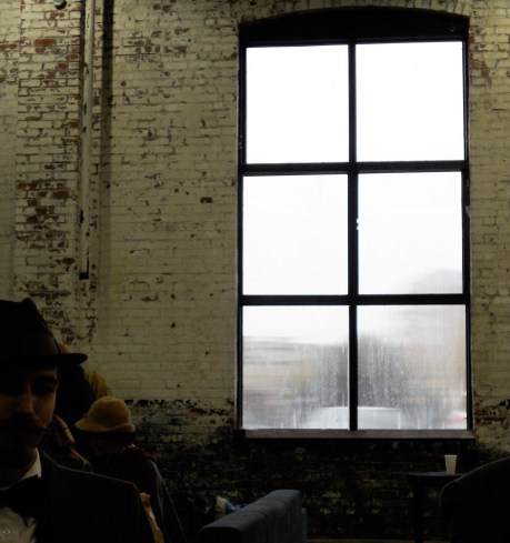 The "art" shot of a rain-soaked window with our friend Riley (who won for Best Men's Facial Hair) seated on the left. 