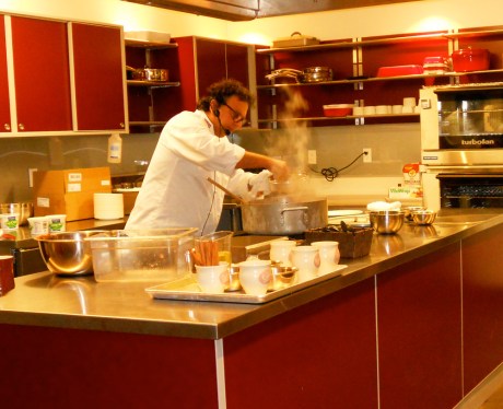 Vikram Vij from Vij's in Vancouver cooks Vij Family's Chicken Curry in the community kitchen at the Victoria Public Market.