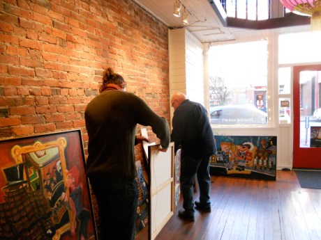 Hanging day: Michael and GJ deciding where each piece will be.