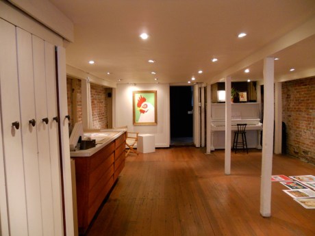 Hanging day, the large chicken illuminated on the back wall.