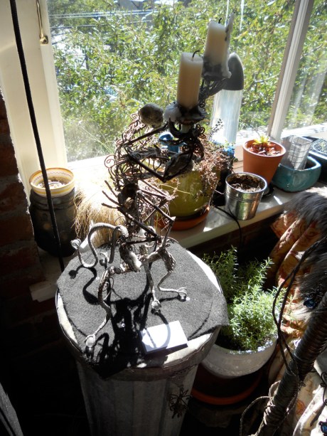 GJ's skeleton candlesticks stand guard over the herb pots.