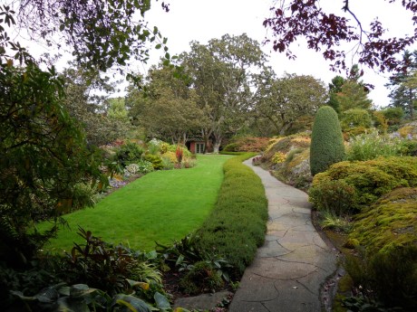 A river of green lawn and the path which leads to the summer house, the first building constructed on the property in 1946. In the spring and summer months, this view would be exploding with every colour of flower. 