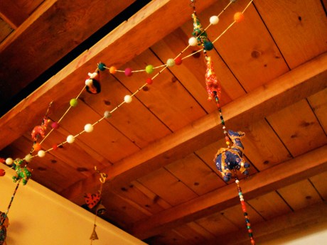 Little felted wool balls strung to make colourful garlands, along with camels from India and my favourite glass fox.